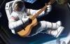 Astronauta tocando guitarra-292974.jpg